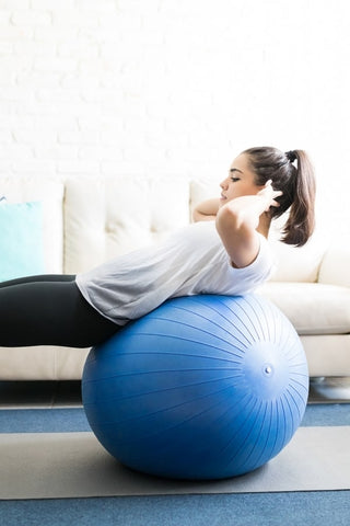 Woman Exercising on Exercise Ball