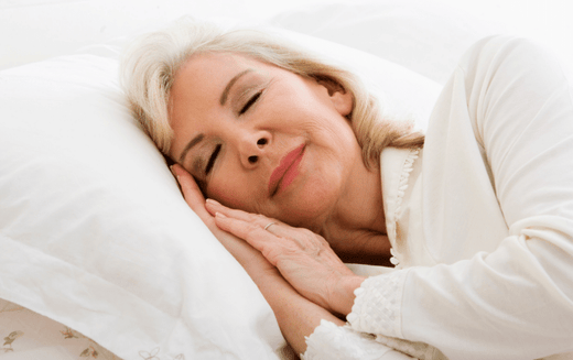 Woman sleeping on low air mattress
